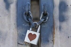 Door with a heart lock symbolizing a closed heart